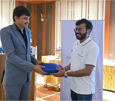 A moment of recognition at a PySquad team event